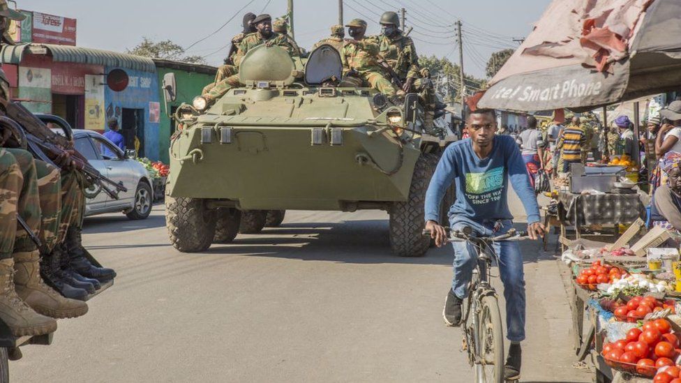 A Zambian Army armored personnel carrier patrols the Chawama Compound in Lusaka on August 3, 2021 after President Edgar Lungu ordered the army to help police curb political violence that has characterised the run-up to the August 12 General election