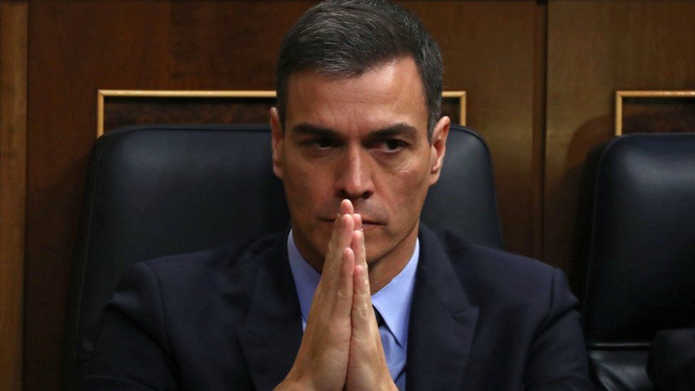 Spain's Prime Minister Pedro Sanchez clasps his hands together almost as if in prayer in this close-up from the Spanish parliament on Wednesday