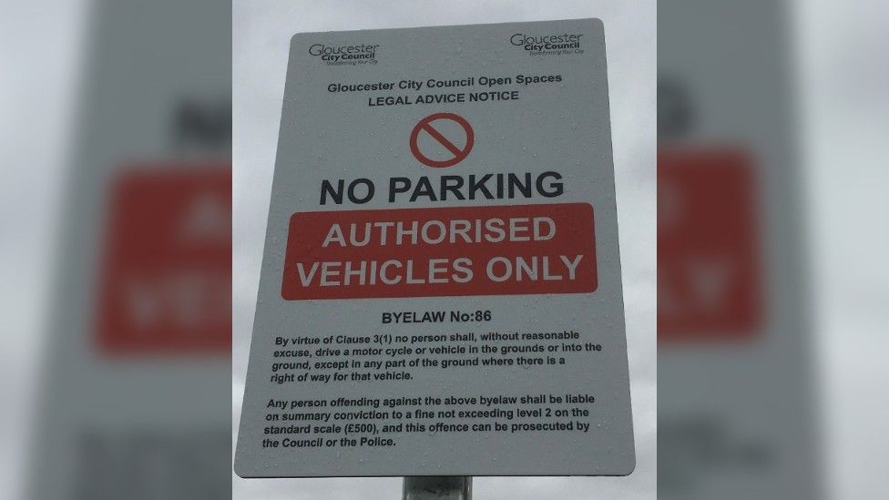 Signs warning motorists about the bylaw