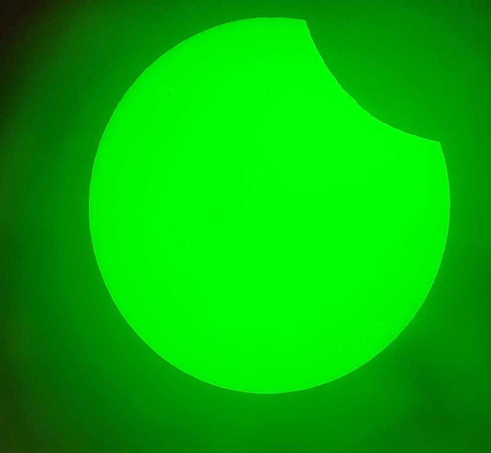 A partial solar eclipse taken from a telescope using a Herschel prism