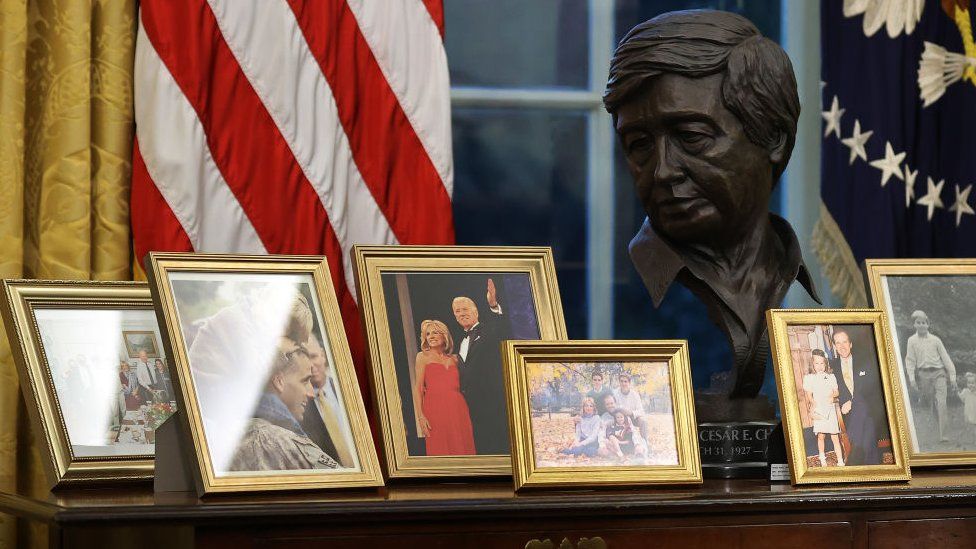 Bust of Cezar Chavez alongside family pictures in Biden's office on 20 January 2021