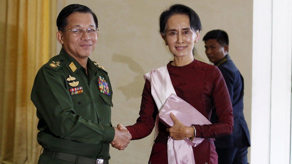 Myanmar"s Commander-in-Chief Min Aung Hlaing (L) shakes hands with National League for Democracy (NLD) party leader Aung San Suu Kyi
