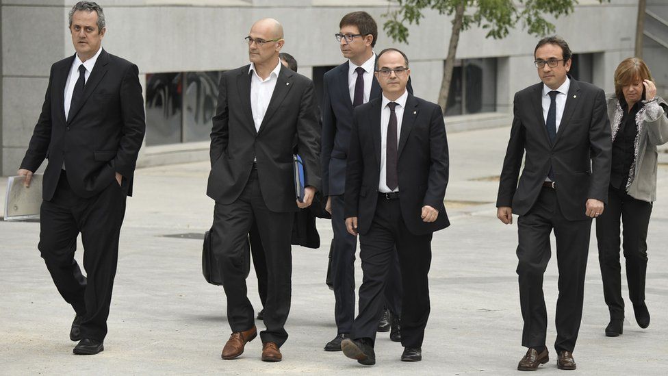 Members of the deposed Catalan regional government arrive at a court in Madrid
