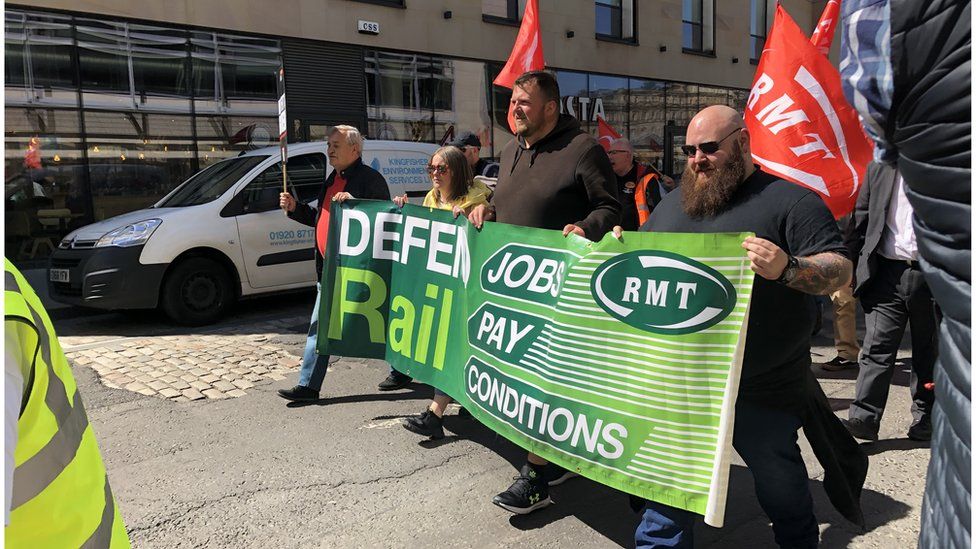RMT workers holding a protest banner