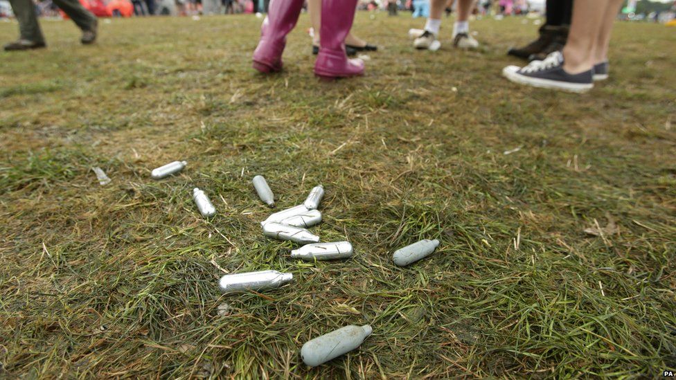 Discarded laughing gas canisters at a music festival