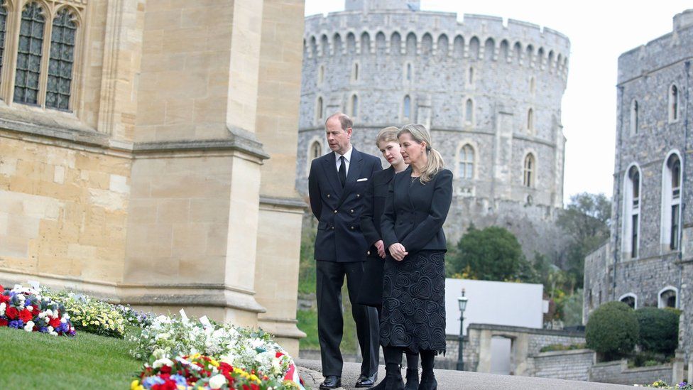 The Earl of Wessex, Lady Louise Windsor, and the Countess of Wessex view flower tributes outside St George's Chapel on 16 April 2021