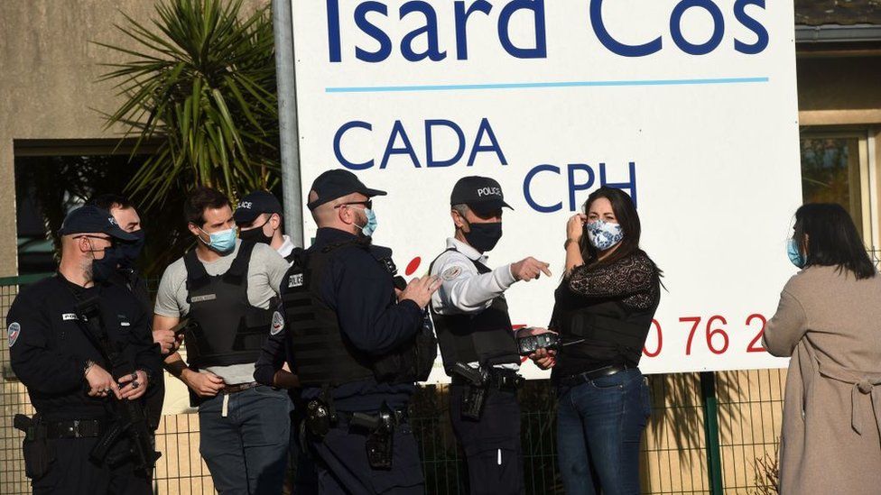 Police outside an immigration centre in the southwestern French city of Pau after a manager there was stabbed to death, 19 February 2021