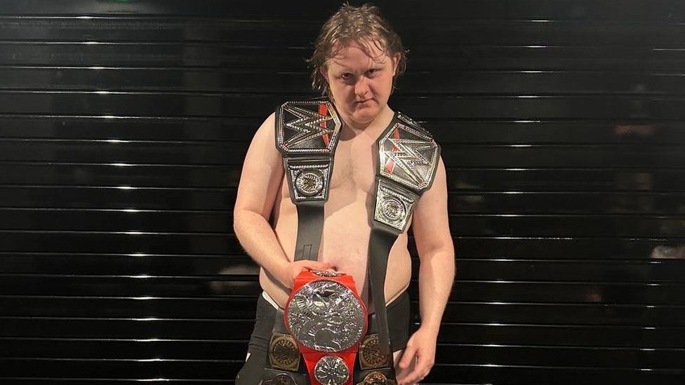 Lewis Capaldi comically posed with five WWE belts to mark his five number ones