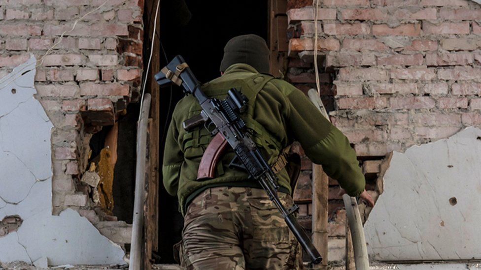 Ukrainian soldier in a building on the front line on 8 December 2021 in Marinka, Ukraine