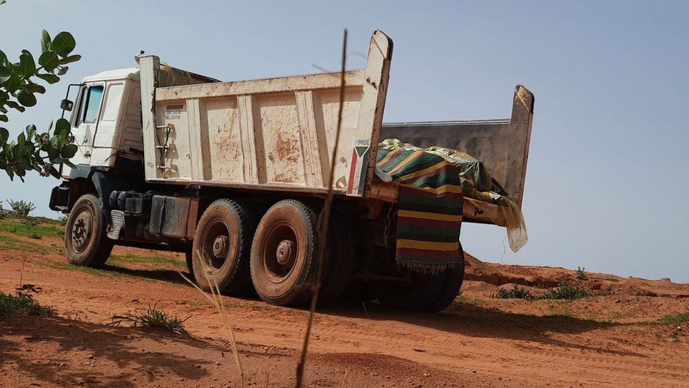 truck with covered up bodies in it