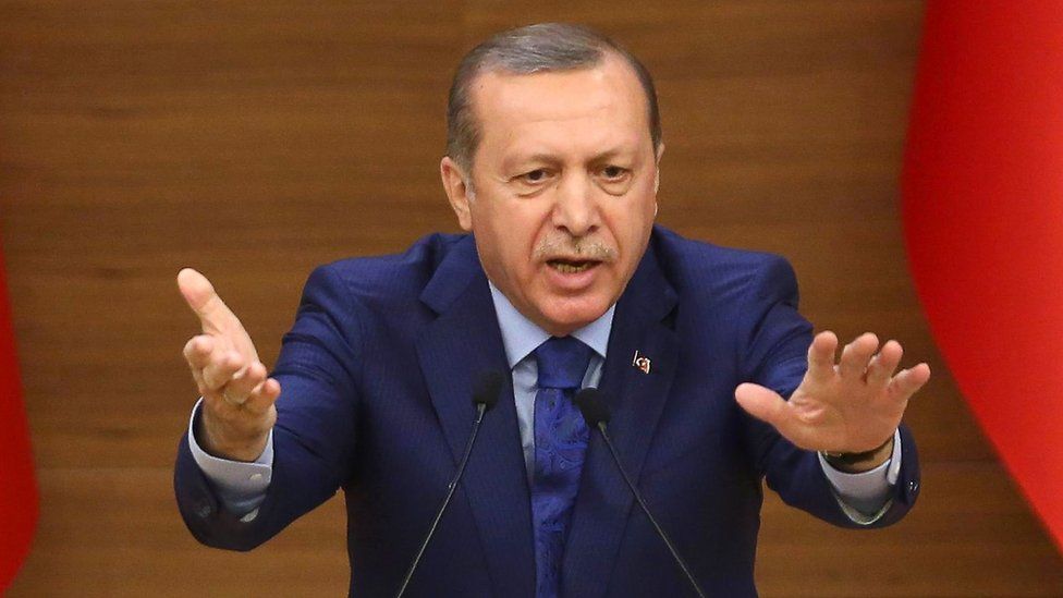 Turkish President Recep Tayyip Erdogan gestures as he delivers a speech in Ankara on 16 March 2016