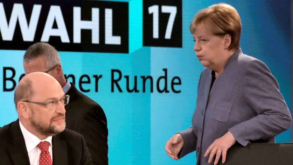 Angela Merkel looks exasperated with Martin Schulz on a TV set before a post-election debate