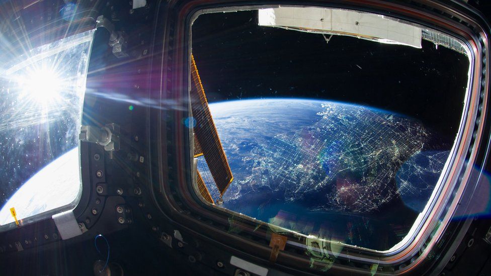 Earth viewed through a windo on the ISS