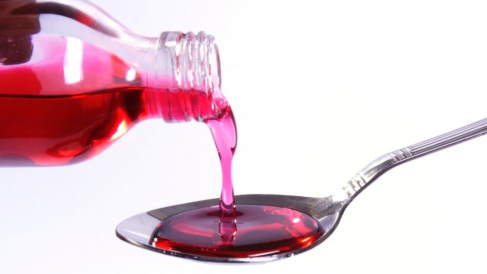 File image of cough syrup being poured.