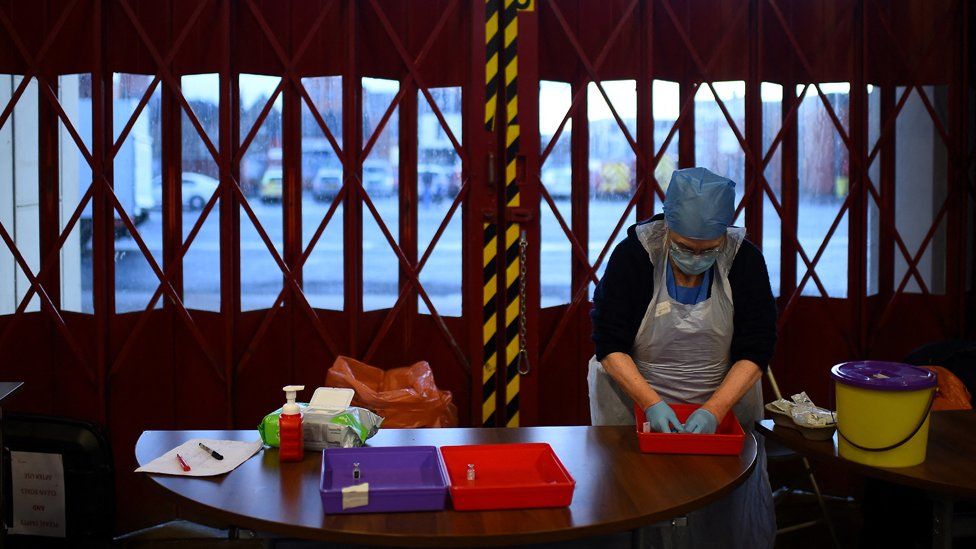 File image of a nurse making preparations at a pop-up vaccine centre at Belfast Central Fire Station