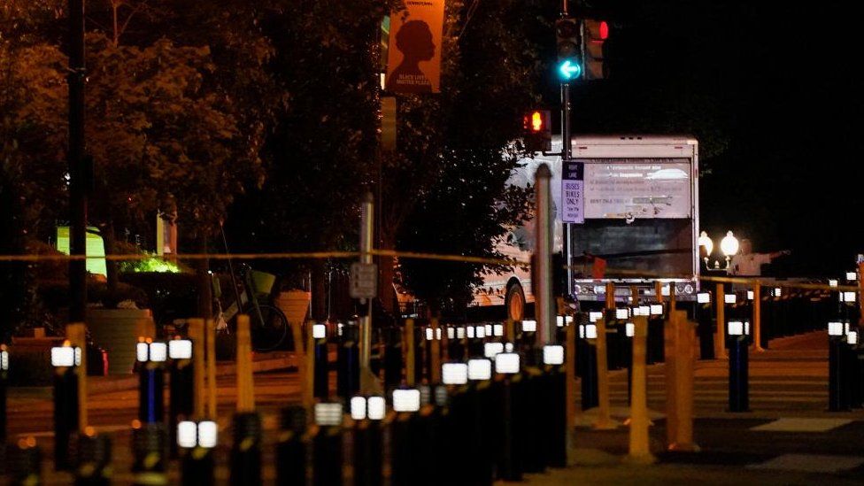 US officials analyse   a container  motortruck  that crashed into information    barriers adjacent   the White House