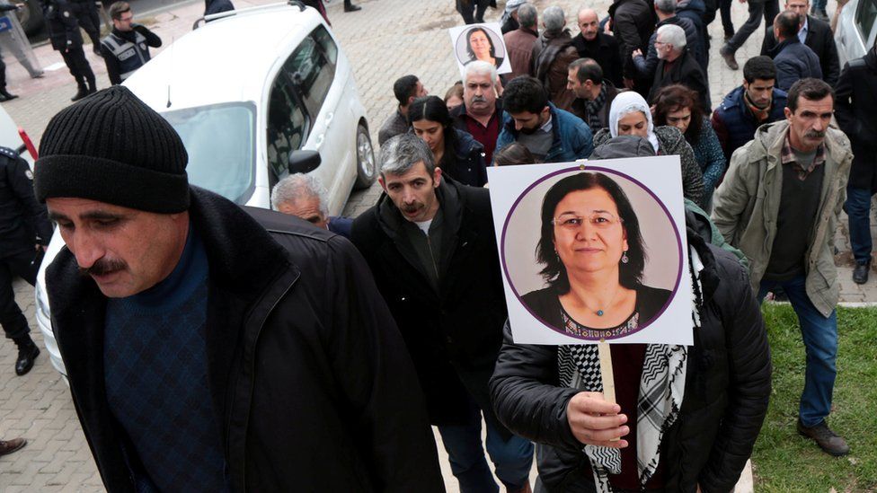 A supporter of pro-Kurdish Peoples" Democratic Party (HDP) holds a picture of jailed lawmaker Leyla Guven, during a demonstration in solidarity with her, in Diyarbakir, Turkey January 12, 2019