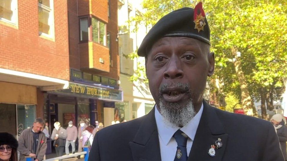 Man with grey beard wearing beret and RBL tie