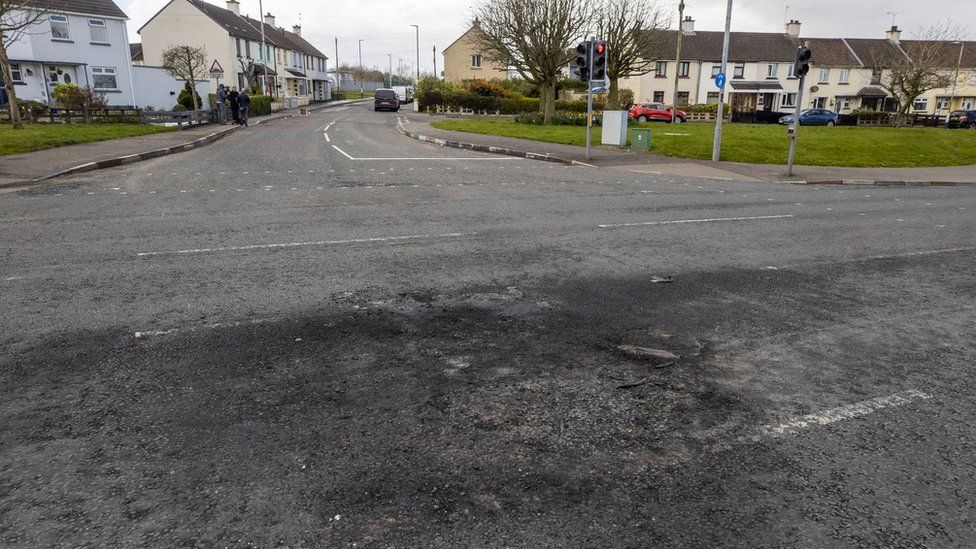 Scorched section of the Dungiven Road where wooden pallets where set alight after another night of unrest