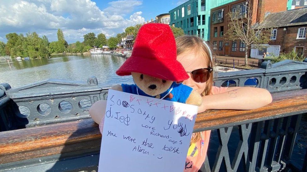 Alina holding her Paddington bear