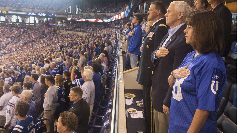 Mike Pence tweeted a photo of himself standing during the US national anthem at an NFL game on Sunday, 8 October 2017