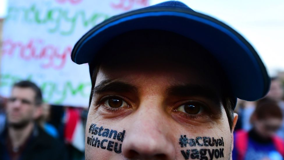 Budapest demonstrator with pro-CEU slogan painted on his face, 9 Apr 17