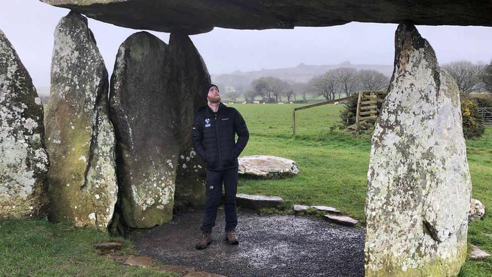 Archaeologist Tomos Jones at Pentre Ifan Neolithic burial chamber