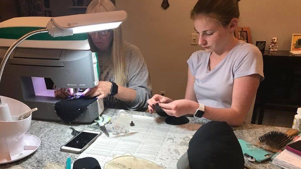 Megan and her grandmother sewing