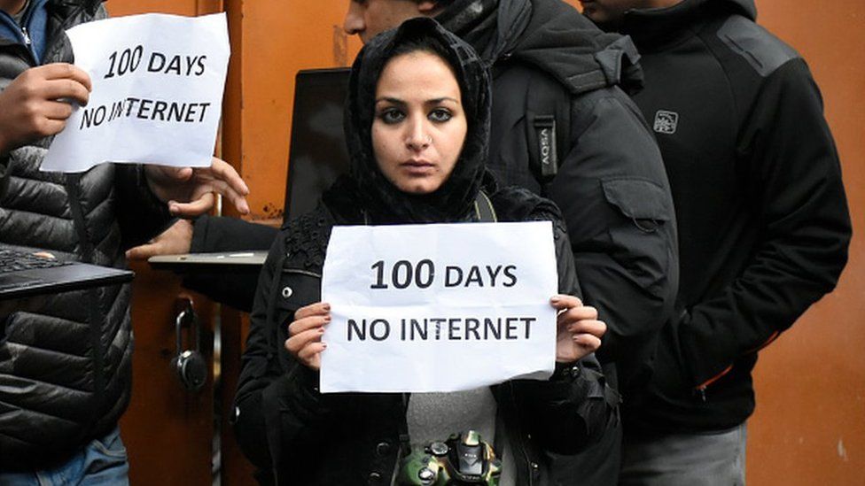 A Kashmiri journalist hold a placard during protest against the continous internet blockade for 100th day out Kashmir press club , Srinagar, Indian Administered Kashmir on 12 November 2019.