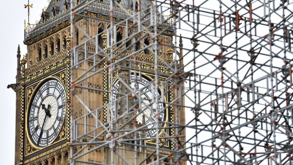 Elizabeth Tower (Big Ben) is seen through scaffolding at the Houses of Parliament in London on 21 August 2017
