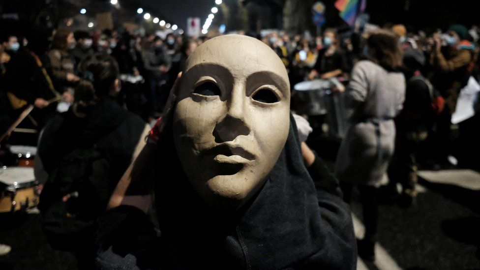 A demonstrator wearing a mask takes part in protest against imposing further restrictions on abortion law, near the house of Law and Justice leader Jaroslaw Kaczynski in Warsaw, Poland, 23 October, 2020.