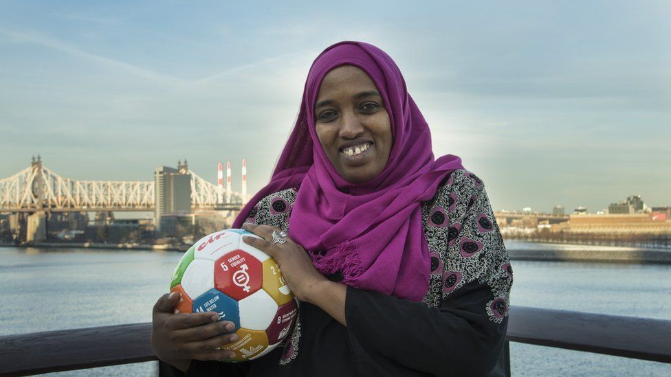 Fatuma Abdulkadir Adan standing with a football