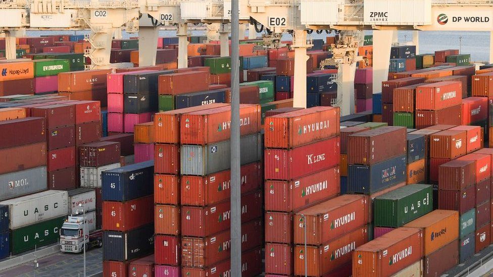 Containers are stacked at the port of Jebel Ali, operated by the Dubai-based giant ports operator DP World, in the southern outskirts of the Gulf emirate of Dubai, on June 18, 2020
