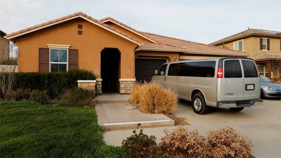 A van sits parked on the driveway of the home of David Allen Turpin and Louise Ann Turpin in Perris, California.