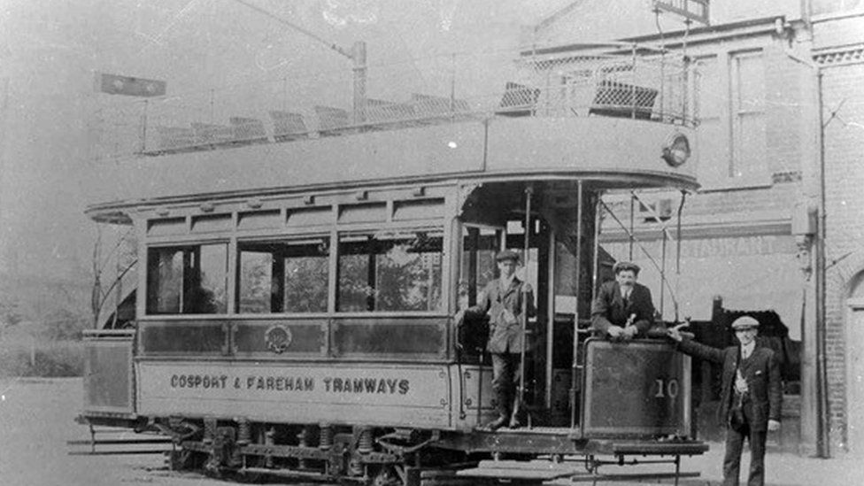 A black and white still of one of the old trams