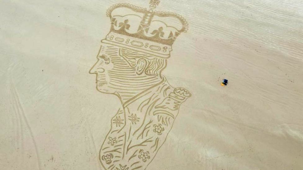King Charles drawn in sand