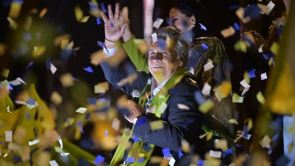 The Ecuadorean presidential candidate of the ruling Alianza PAIS party, Lenin Moreno, waves to his supporters as they wait for the final results of the runoff election, in Quito on April 2, 2017.