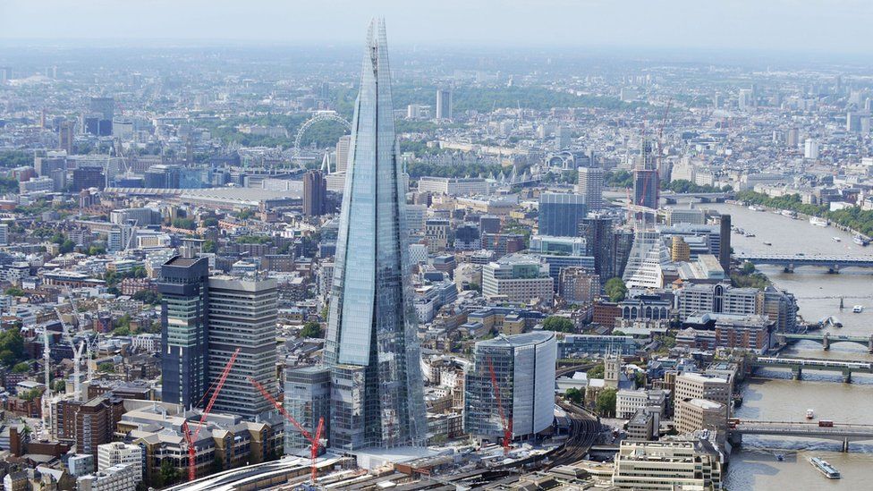 Aerial view of The Shard skyscraper and surrounding London cityscape