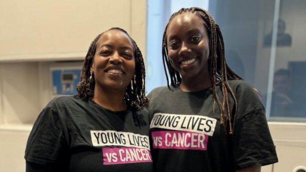 Two women wearing Young Lives vs Cancer running vests