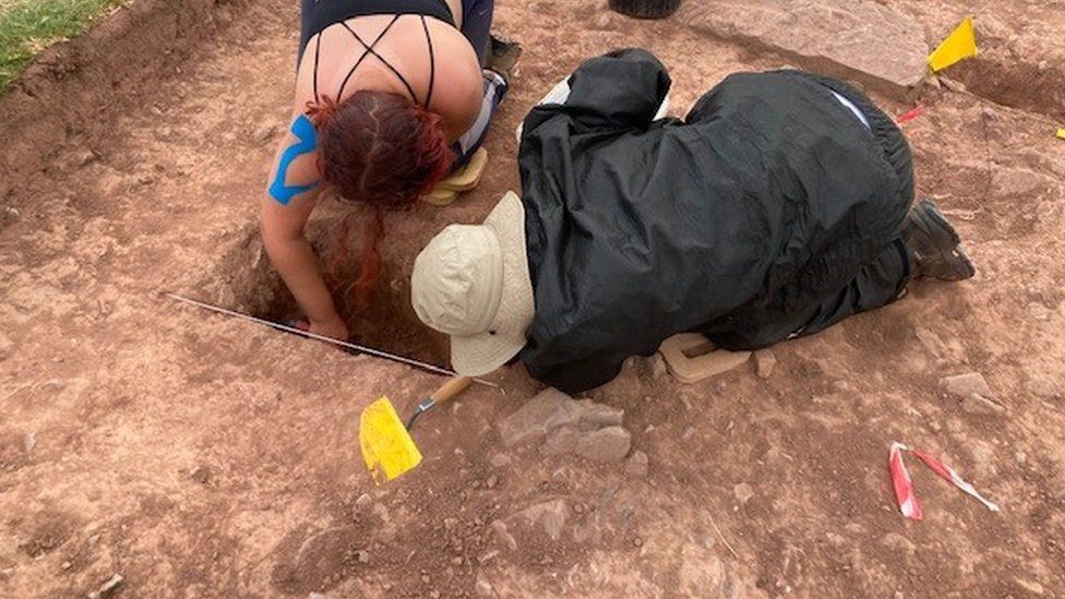 Archaeologists excavating the site