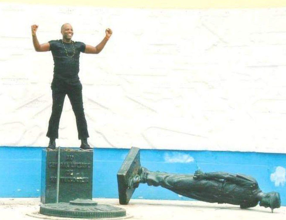 The first time Mr Essama toppled Gen Leclerc's statue in 2003