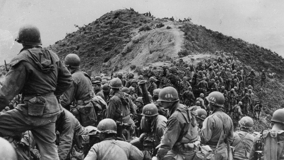 Men of the 187th US Regimental Combat Team prepare to take a ridge position somewhere in Korea.