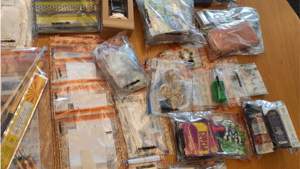 The drugs, cash and suspected weapons seized