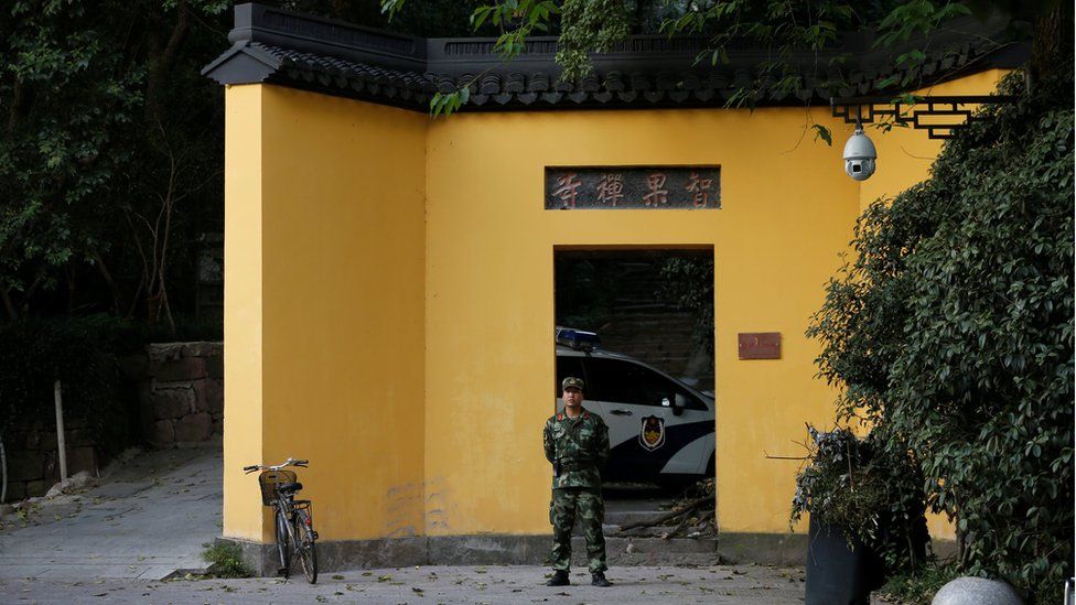 A paramilitary policeman stands in front of a temple near the West Lake, before the G20 Summit in Hangzhou, Zhejiang Province, China. 31 August 2016.