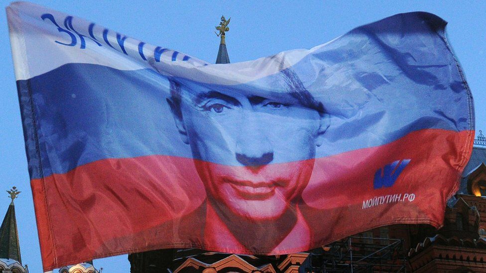 A Russian flag printed with President Putin's face