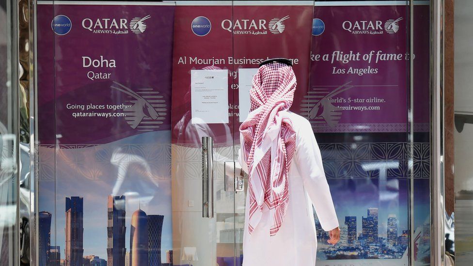 A man outside Qatar Airways office in Riyadh, Saudi Arabia