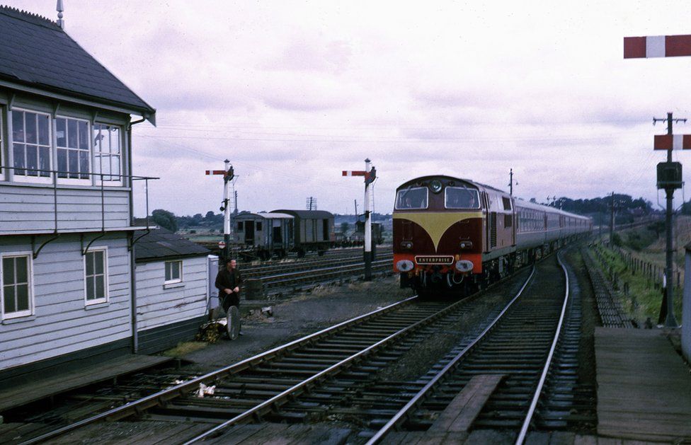 An Enterprise train passing through a station in 1970