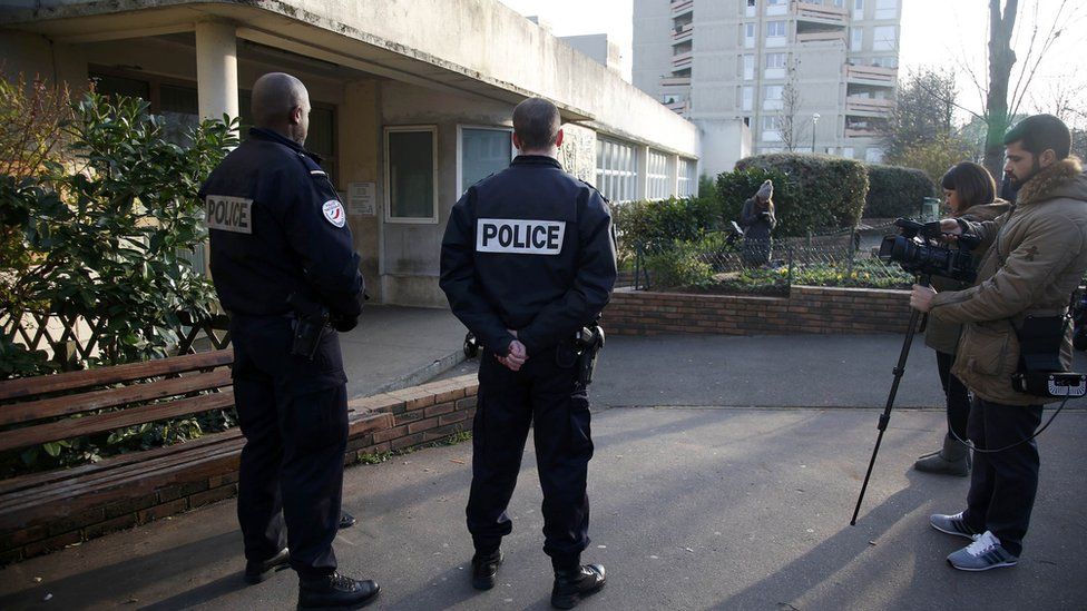 French police and journalists stand in front of the nursery school in Aubervilliers, near Paris. 14 Dec 2015