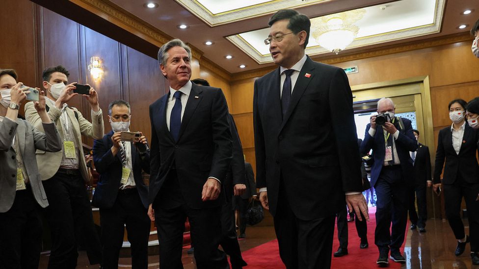 US Secretary of State Antony Blinken walks with China's Foreign Minister Qin Gang at the Diaoyutai State Guesthouse in Beijing on Sunday, 18 June