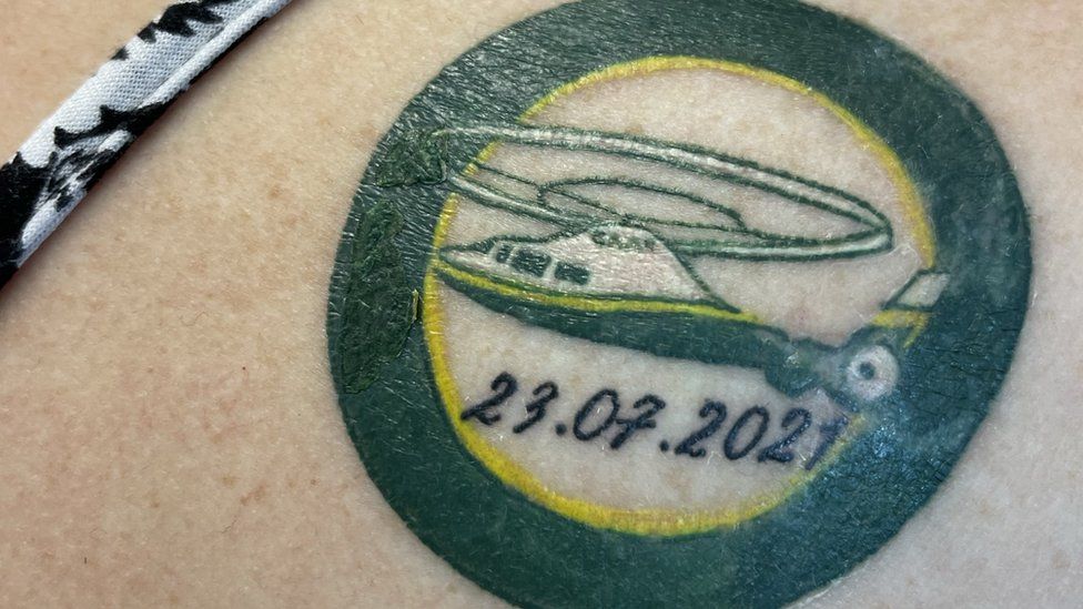 Close of up the tattoo depicting the Great North Airt Ambulance and the date she took ill